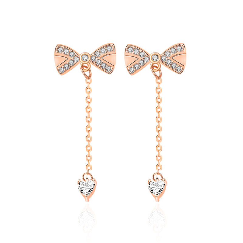 Clous d'oreilles en argent, nœud et pompon