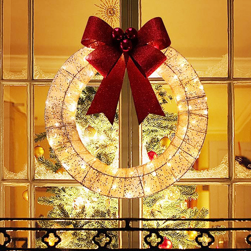 Coroa de Natal com luzes LED e laço, dourada