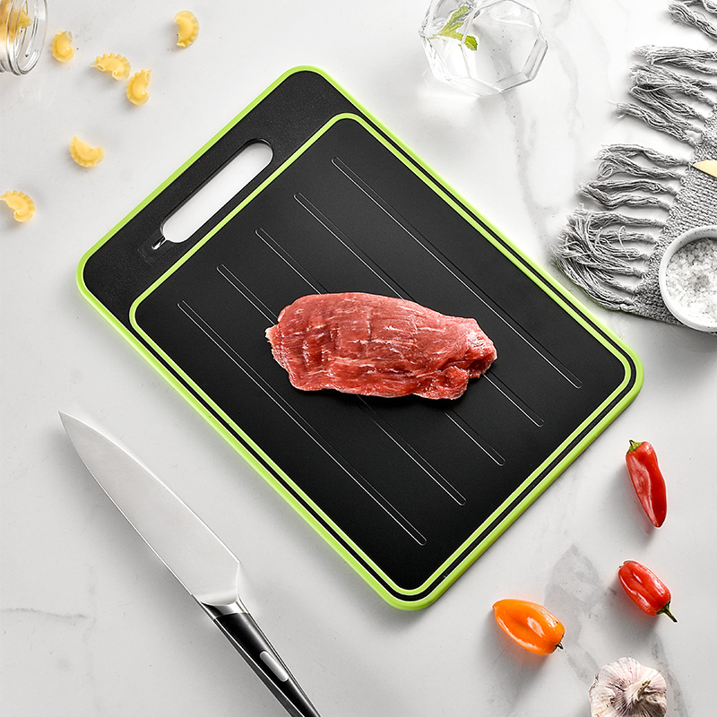 Double-sided cutting board with thawing surface
