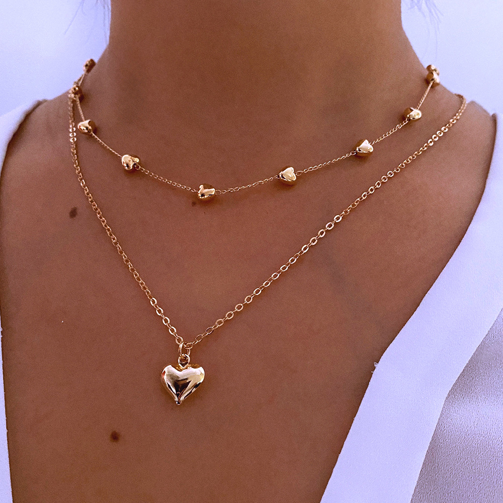 Colar duplo com pendente de coração, dourado